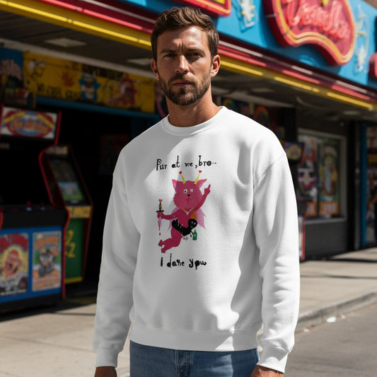 Man wearing a white sweatshirt with a graphic design in front of arcade machines.