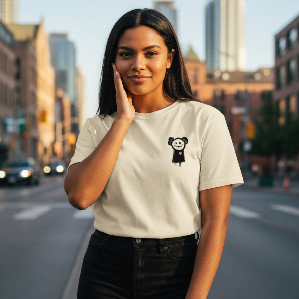 Woman wearing a white t-shirt with a graphic design on a city street