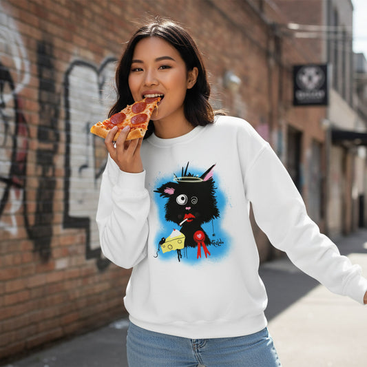 Woman wearing a white sweatshirt with a black character design, eating a slice of pizza on a street.
