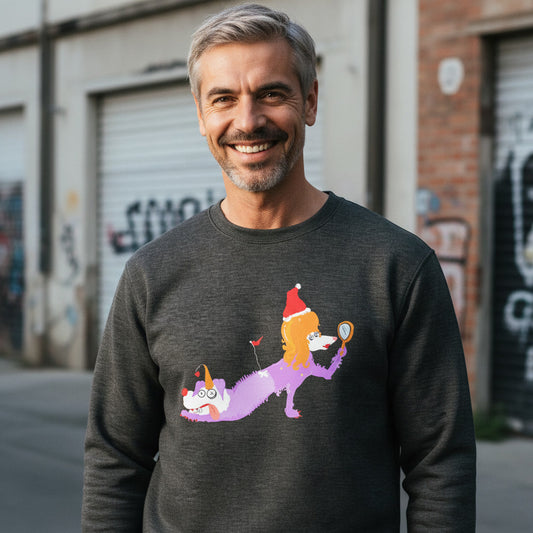 Man wearing a dark gray sweatshirt with a colorful graphic design, standing in an urban setting.